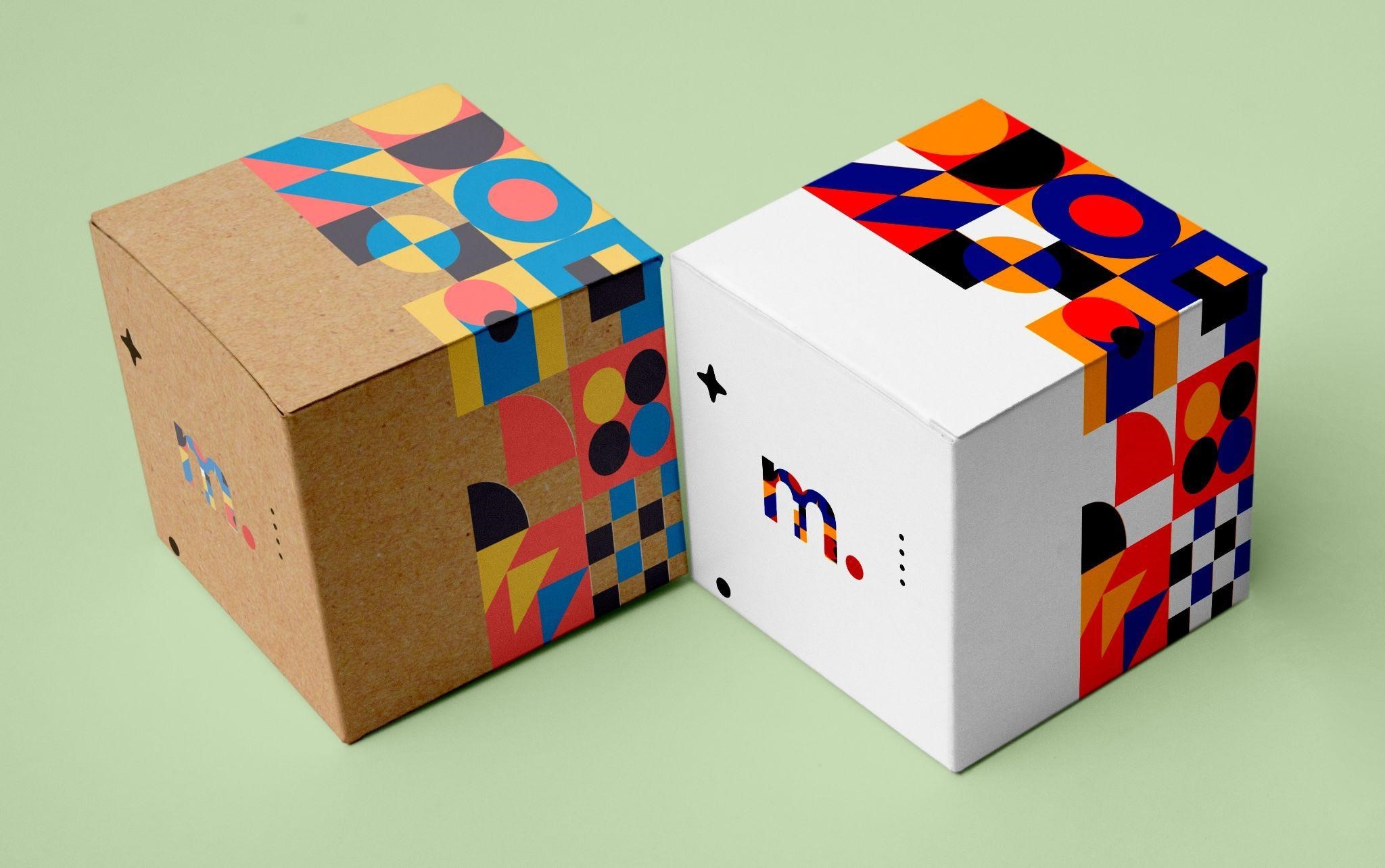 Product packaging boxes with the same design printed on white cardstock versus brown kraft cardstock